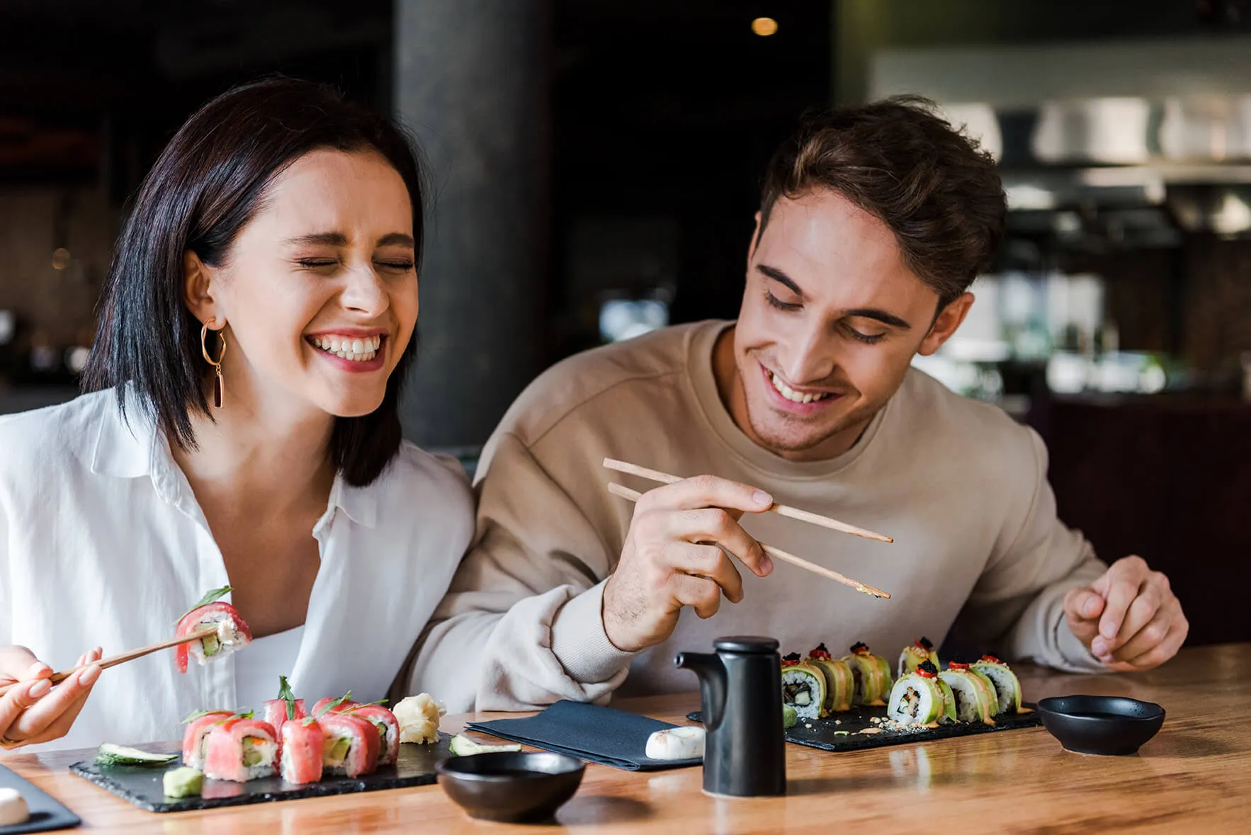 Customers at a sushi restaurant